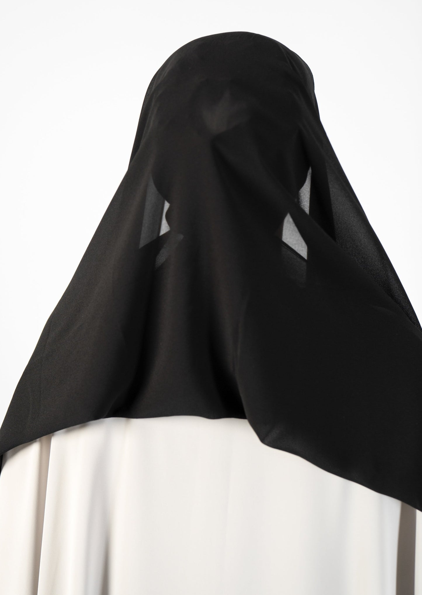 Introducing the 'Tie Back Instant Hijab' which features our Premium Chiffon shawl stitched to our Cotton Lycra Inner cap. The tie-back feature allows adjustment of tightness to ensure versatility and upmost comfort. A perfect blend of two staple tone grays suitable for almost any outfit. Its easy-to-wear nature makes it essential in every wardrobe.