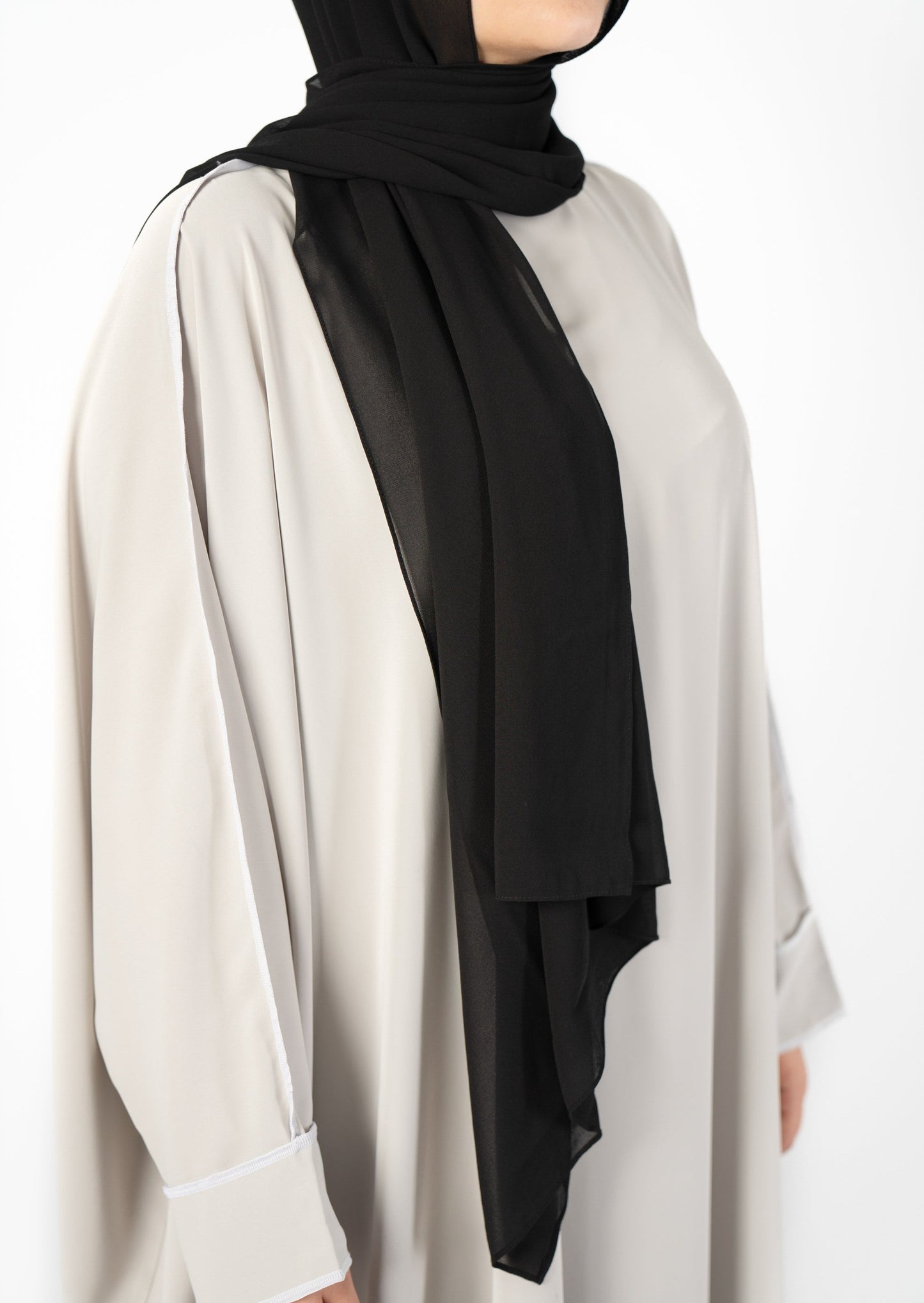 Introducing the 'Tie Back Instant Hijab' which features our Premium Chiffon shawl stitched to our Cotton Lycra Inner cap. The tie-back feature allows adjustment of tightness to ensure versatility and upmost comfort. A perfect blend of two staple tone grays suitable for almost any outfit. Its easy-to-wear nature makes it essential in every wardrobe.