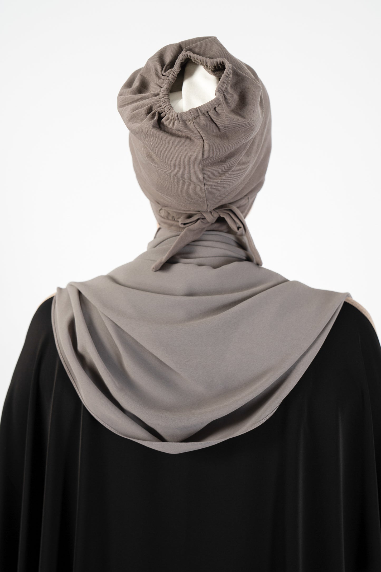 Introducing the 'Tie Back Instant Hijab' which features our Premium Chiffon shawl stitched to our Cotton Lycra Inner cap. The tie-back feature allows adjustment of tightness to ensure versatility and upmost comfort. A perfect blend of two staple tone grays suitable for almost any outfit. Its easy-to-wear nature makes it essential in every wardrobe.