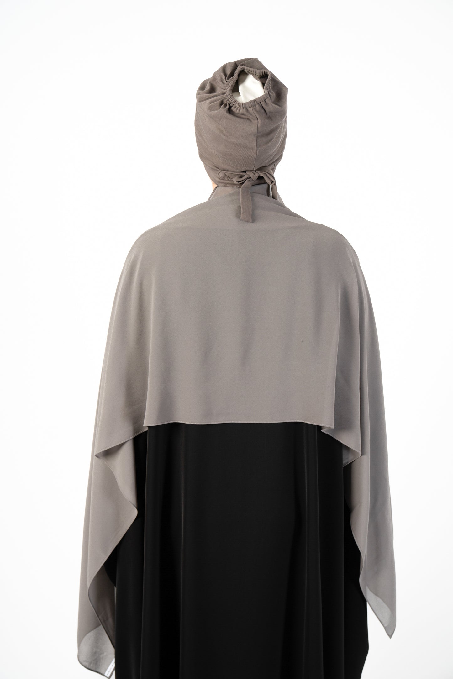 Introducing the 'Tie Back Instant Hijab' which features our Premium Chiffon shawl stitched to our Cotton Lycra Inner cap. The tie-back feature allows adjustment of tightness to ensure versatility and upmost comfort. A perfect blend of two staple tone grays suitable for almost any outfit. Its easy-to-wear nature makes it essential in every wardrobe.