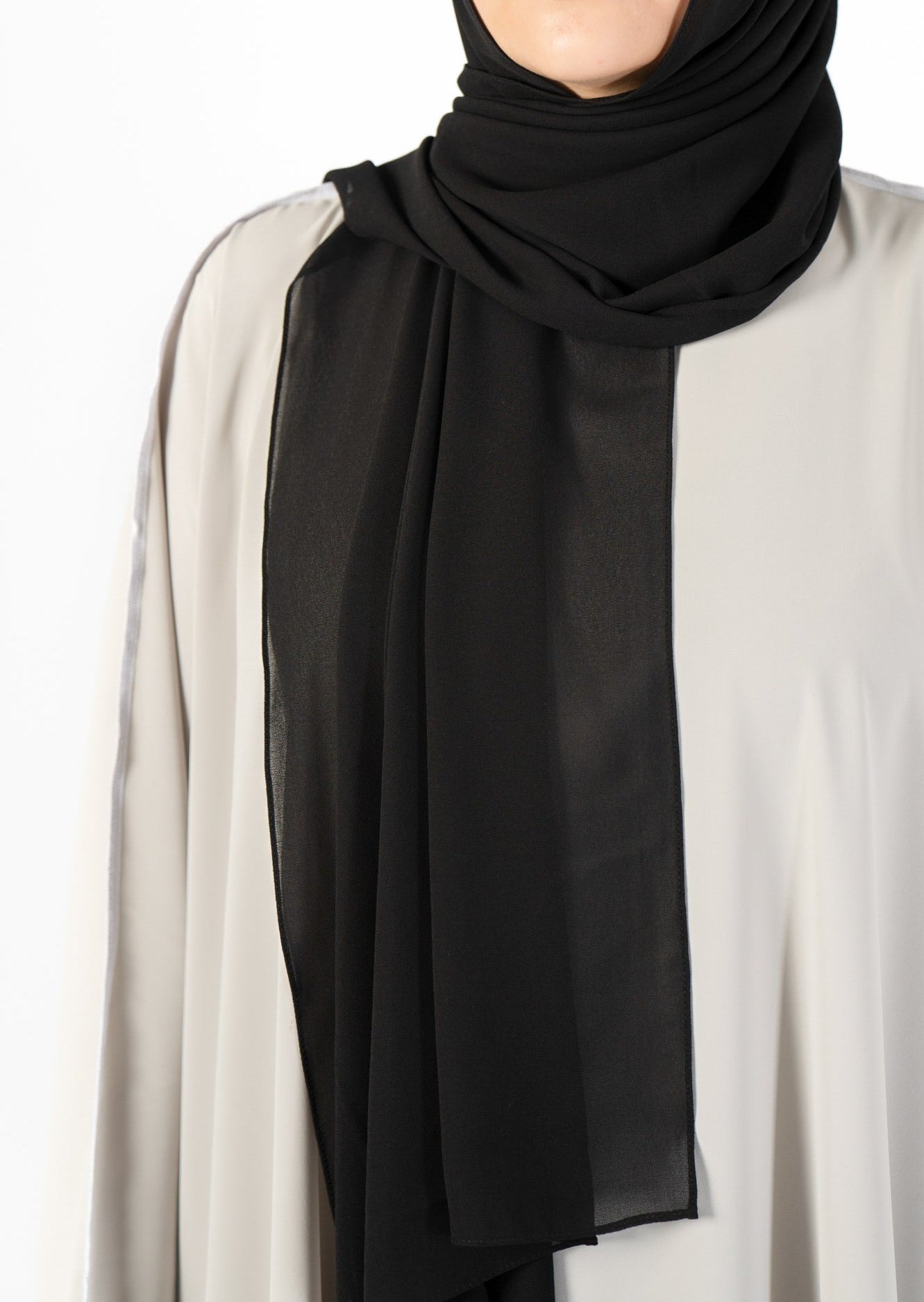 Introducing the 'Tie Back Instant Hijab' which features our Premium Chiffon shawl stitched to our Cotton Lycra Inner cap. The tie-back feature allows adjustment of tightness to ensure versatility and upmost comfort. A perfect blend of two staple tone grays suitable for almost any outfit. Its easy-to-wear nature makes it essential in every wardrobe.