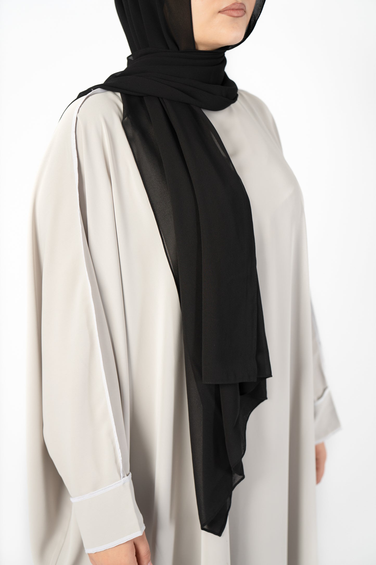 Introducing the 'Tie Back Instant Hijab' which features our Premium Chiffon shawl stitched to our Cotton Lycra Inner cap. The tie-back feature allows adjustment of tightness to ensure versatility and upmost comfort. A perfect blend of two staple tone grays suitable for almost any outfit. Its easy-to-wear nature makes it essential in every wardrobe.